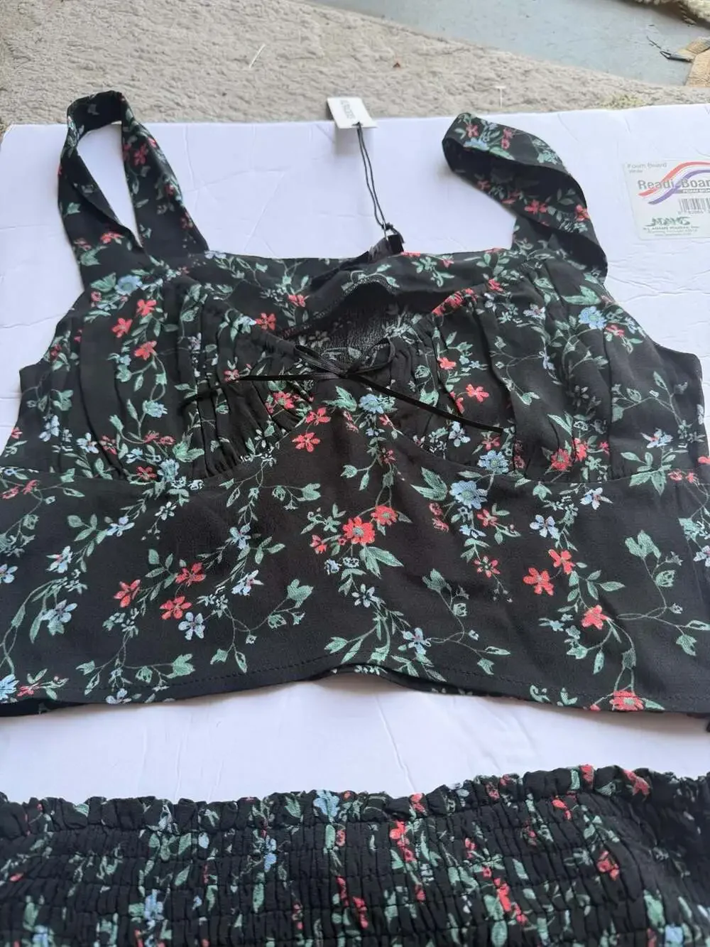 Olivaceous Black Floral Two-Piece Set with Smocked Ruffle Skirt and Crop Top